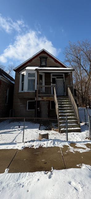 6408 South Rhodes Avenue Chicago, IL 60637 - Photo 18 of 19 a front view of a house with garage