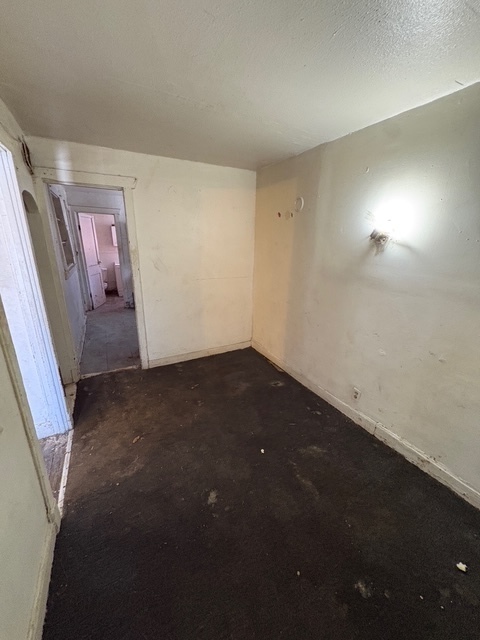 6408 South Rhodes Avenue Chicago, IL 60637 - Photo 3 of 19 an empty room with windows
