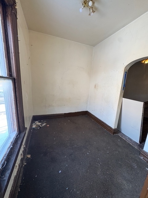 6408 South Rhodes Avenue Chicago, IL 60637 - Photo 9 of 19 a view of an empty room and a window