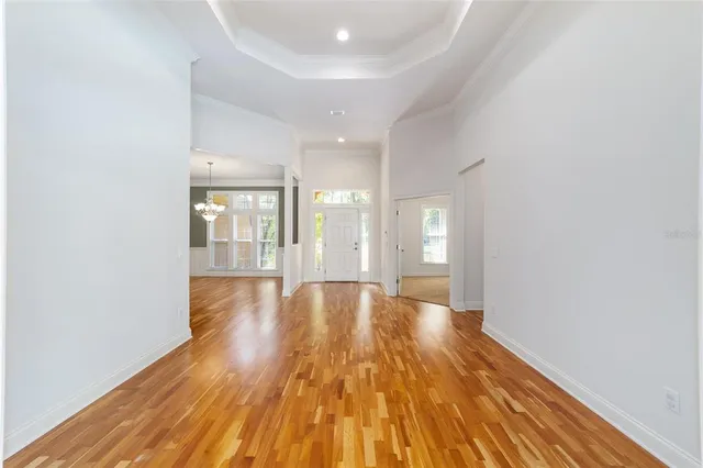a view of a room with cabinet and windows