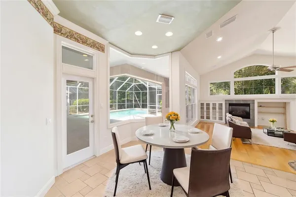 a large kitchen with granite countertop a sink and cabinets