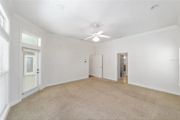 a bathroom with a glass shower door and a sink