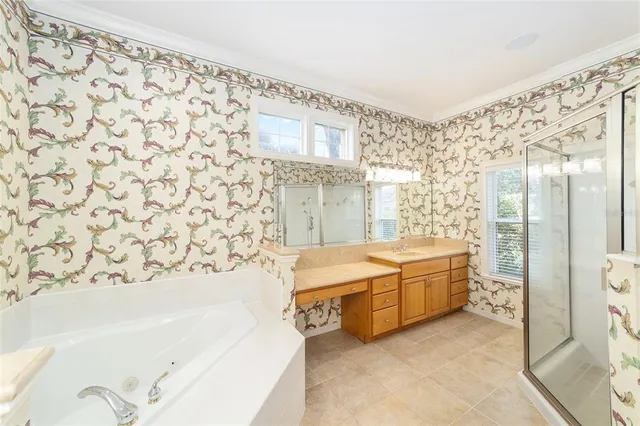 an empty room with a ceiling fan and a window