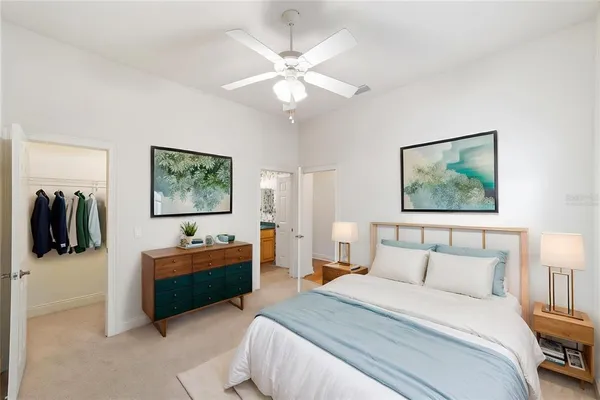 a bathroom with a granite countertop sink a toilet and shower