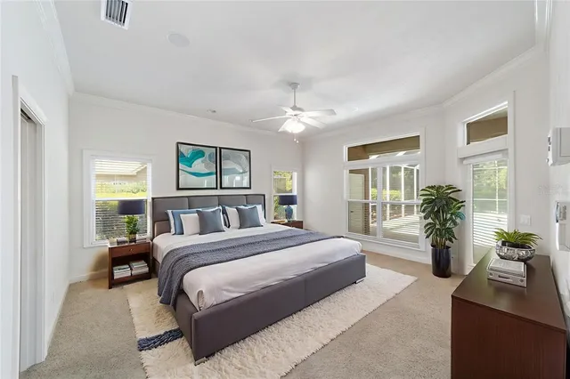 a bedroom with a large bed and a couch