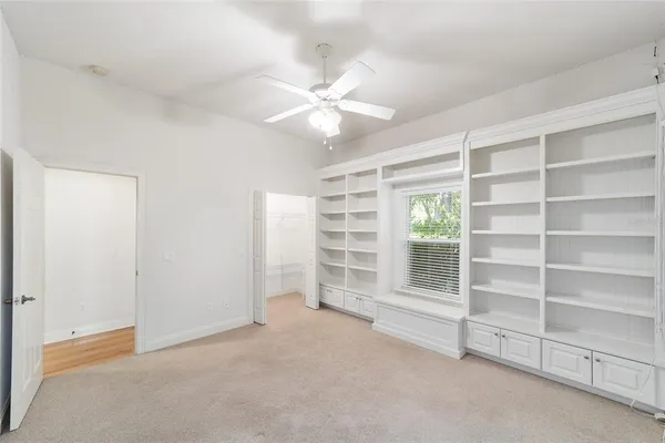 a view of a house with a backyard and porch