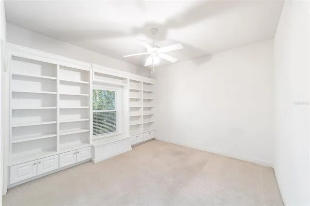 a view of a house with a backyard and porch