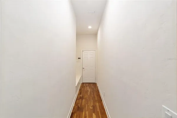 a front view of a house with a yard and a garage