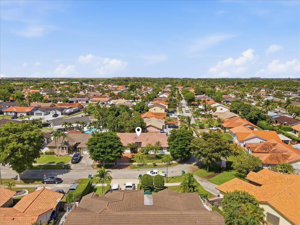20009 Northwest 66th Place Hialeah, FL 33015 - Photo 30 of 33 an aerial view of residential houses with outdoor space