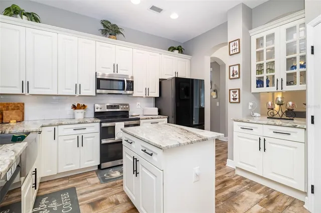 a view of a house with a yard and sitting area