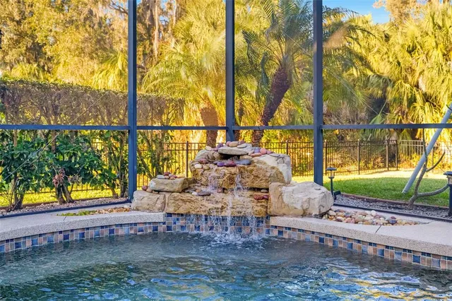 a view of a house with a yard and potted plants