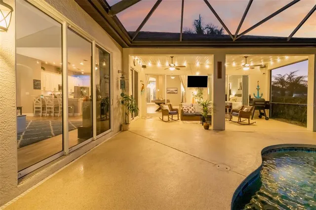 an aerial view of residential house with outdoor space and swimming pool