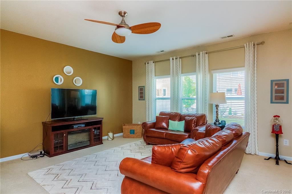 2187 Durand Road Fort Mill, SC 29715 - Photo 5 of 24 a living room with furniture and a flat screen tv
