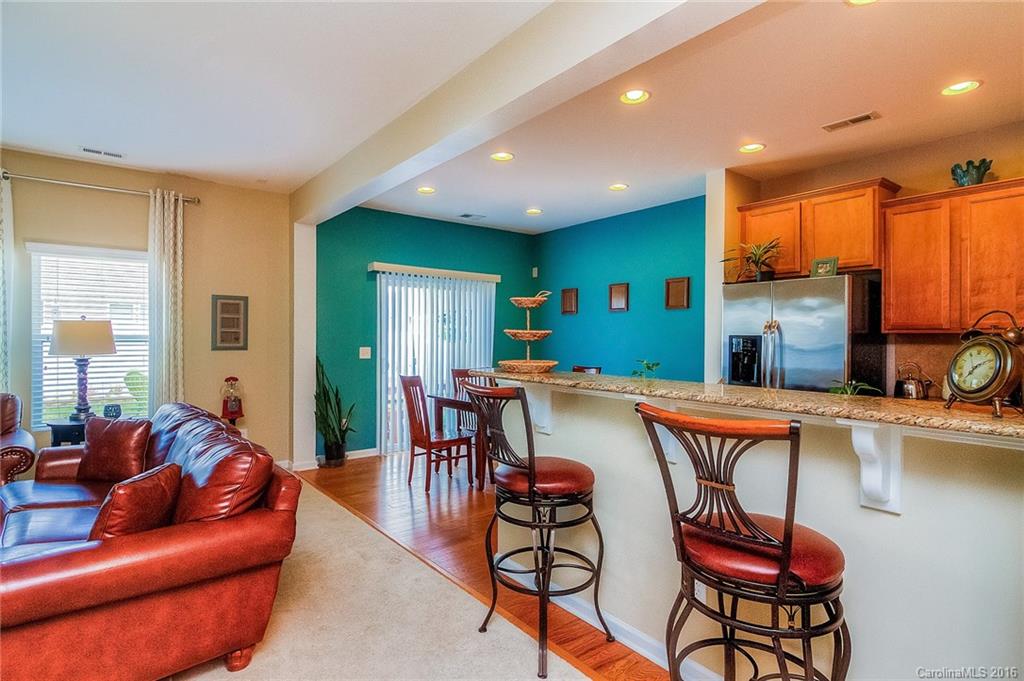 2187 Durand Road Fort Mill, SC 29715 - Photo 7 of 24 a dining room with furniture a rug and a kitchen