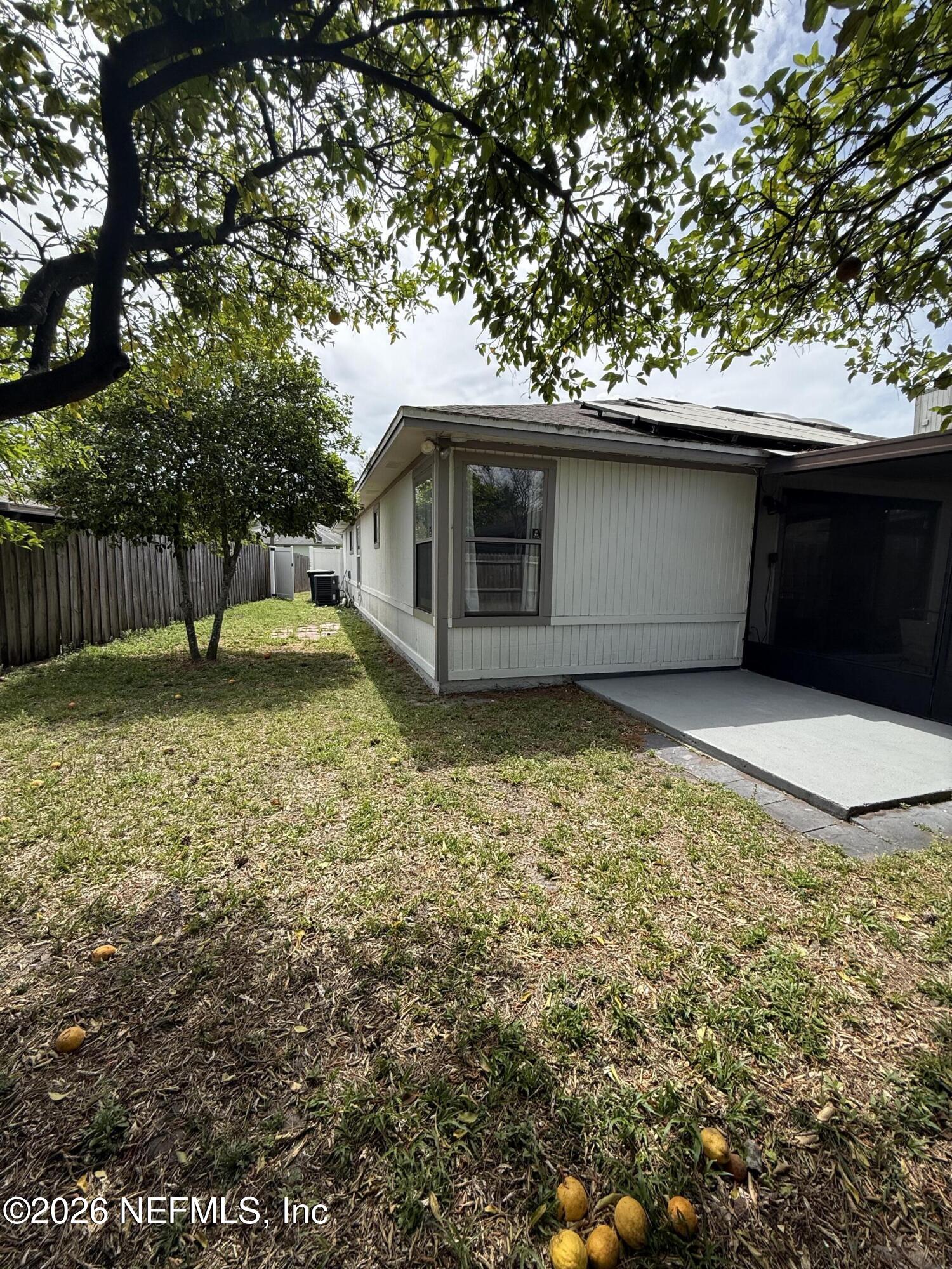 2360 Bitternut Way Jacksonville, FL 32246 - Photo 20 of 26 a front view of a house with a yard