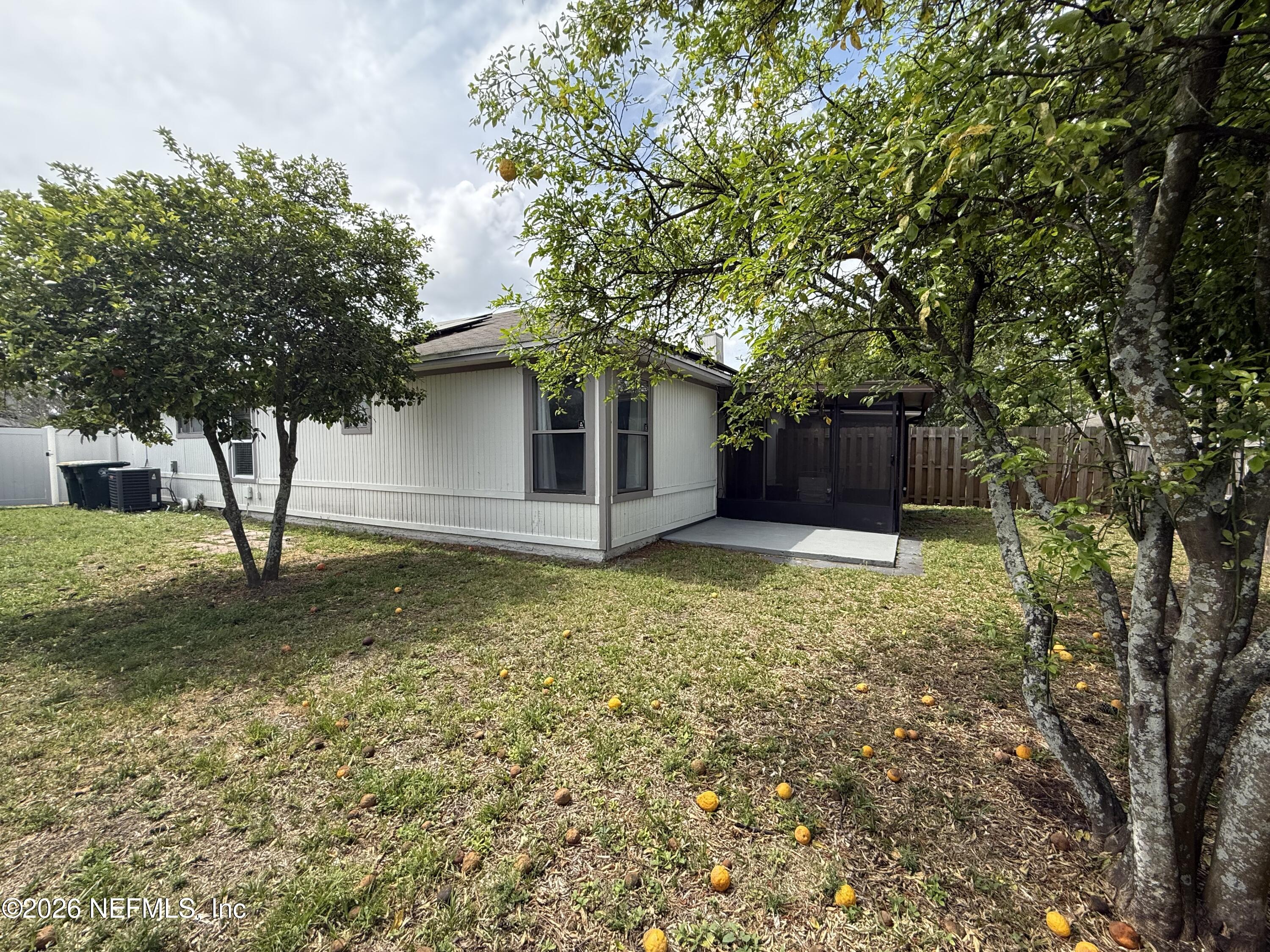 2360 Bitternut Way Jacksonville, FL 32246 - Photo 24 of 26 a house view with a garden space