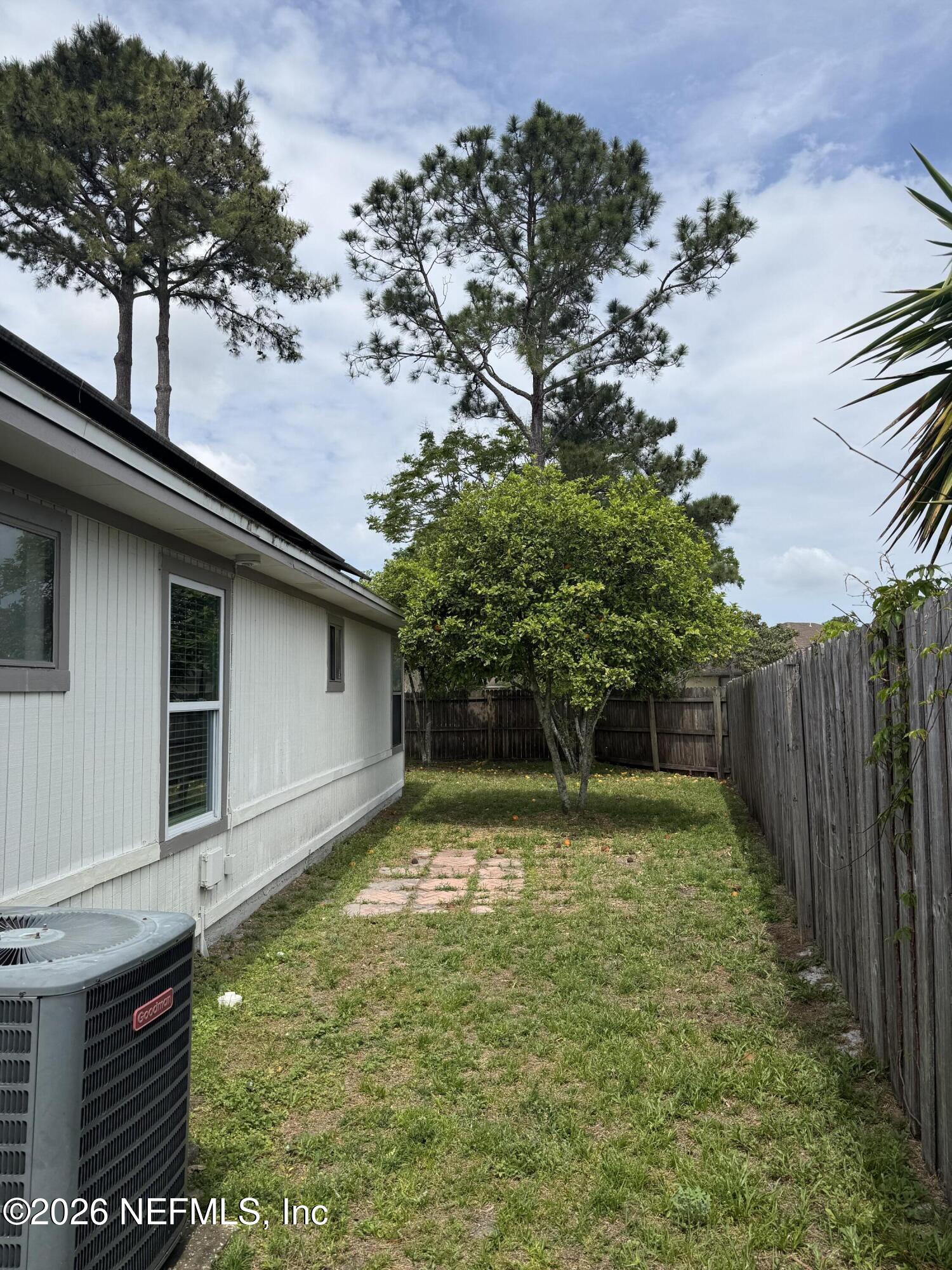 2360 Bitternut Way Jacksonville, FL 32246 - Photo 25 of 26 a backyard of a house with lots of green space