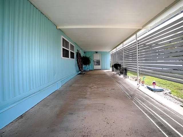 a view of a house with a backyard and a window