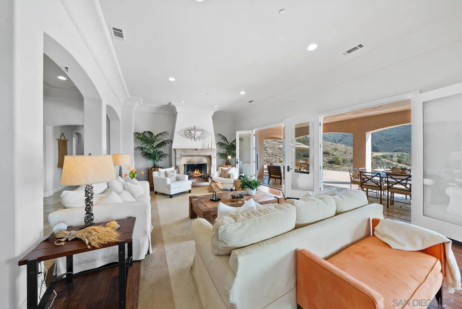 2247 Margarita Glen Fallbrook, CA 92028 - Photo 12 of 40 a living room with fireplace furniture and a large window