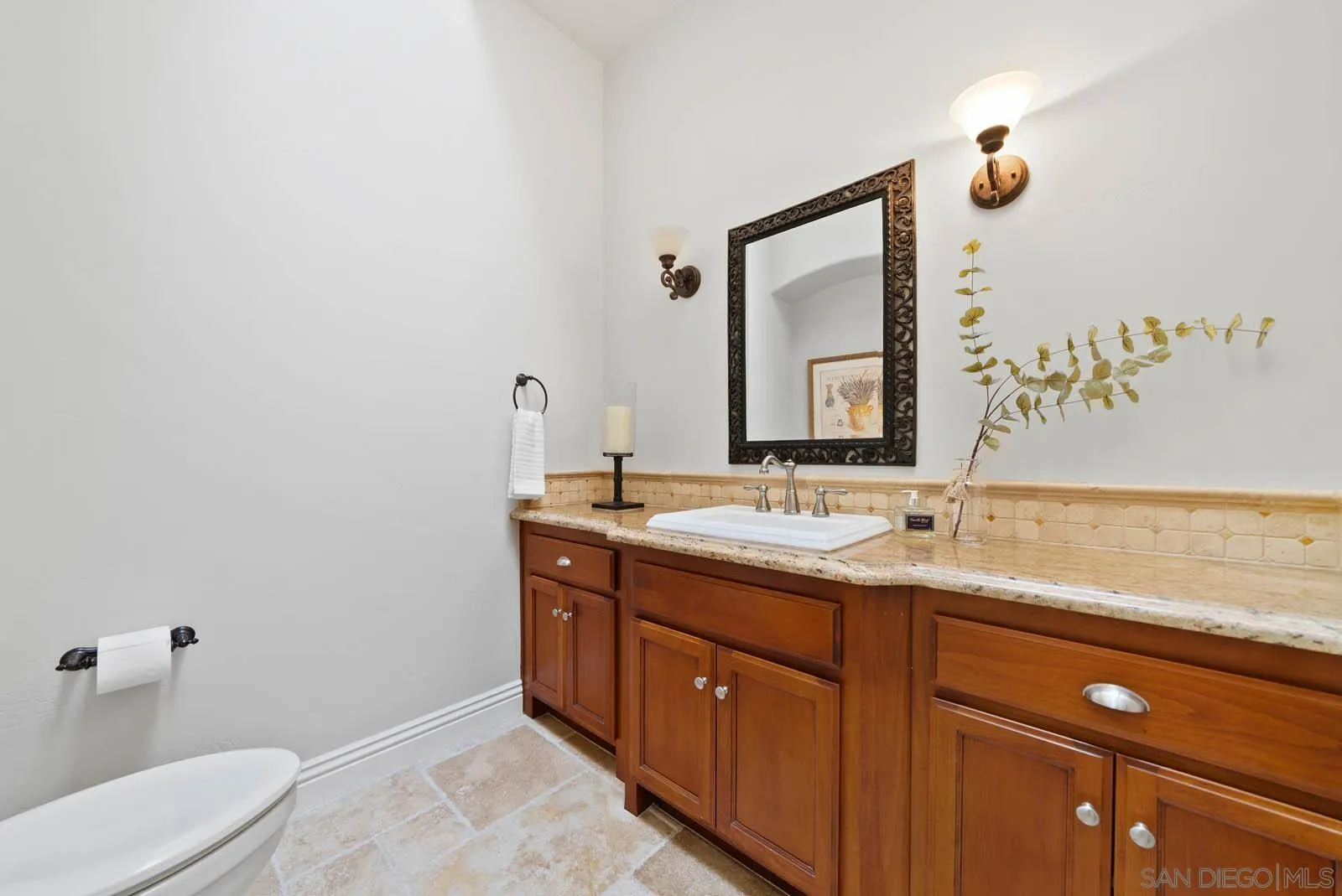 2247 Margarita Glen Fallbrook, CA 92028 - Photo 15 of 40 a bathroom with a toilet sink and mirror