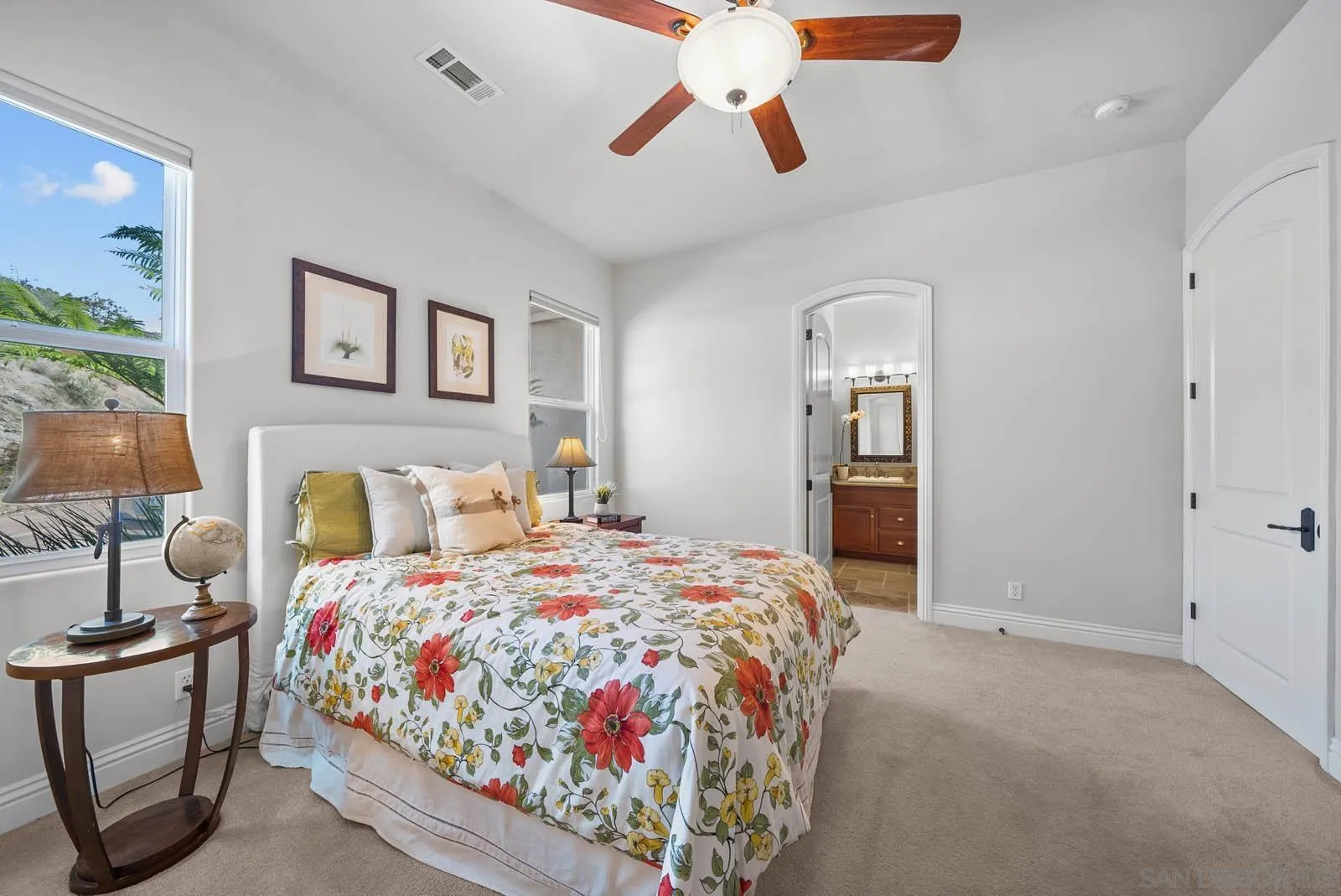 2247 Margarita Glen Fallbrook, CA 92028 - Photo 21 of 40 a bedroom with a bed and a chandelier