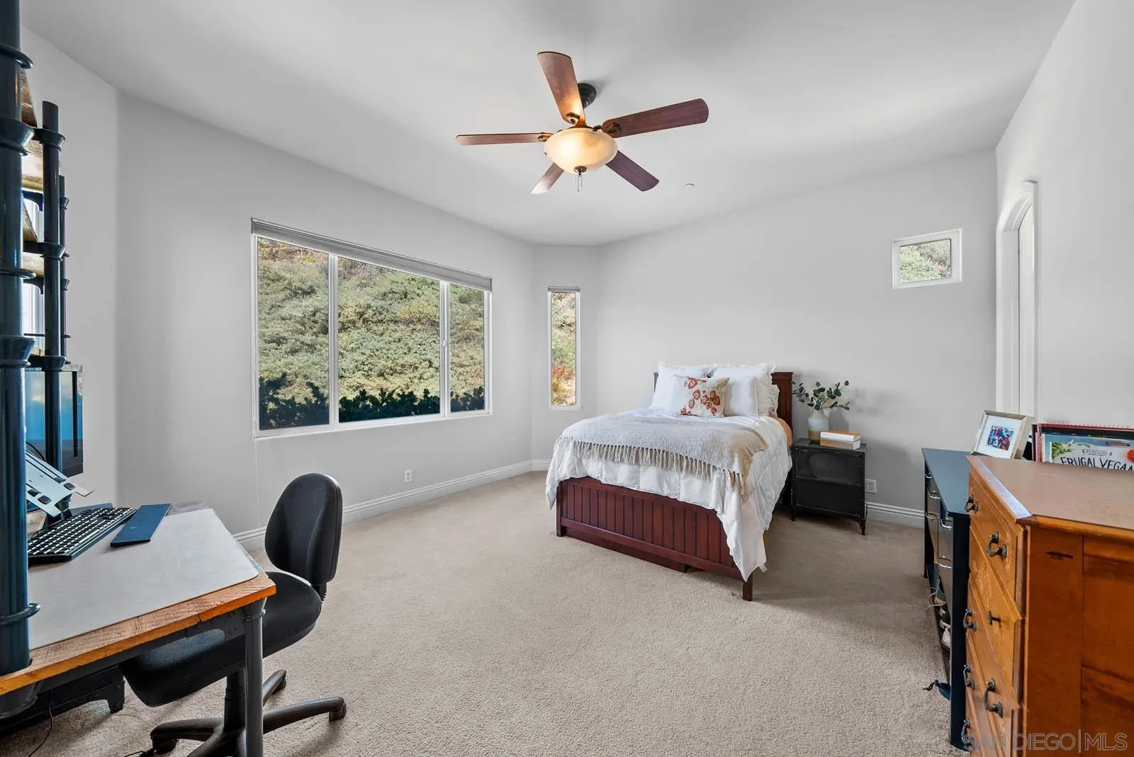 2247 Margarita Glen Fallbrook, CA 92028 - Photo 23 of 40 a bedroom with a bed and a desk