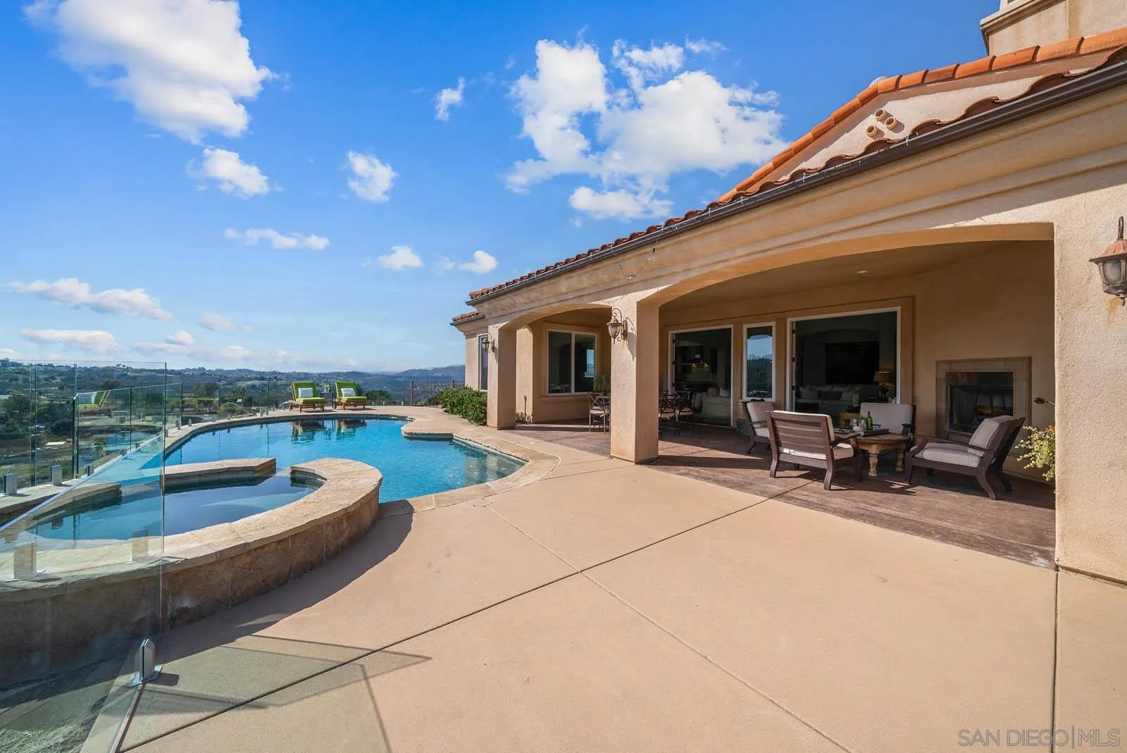 2247 Margarita Glen Fallbrook, CA 92028 - Photo 26 of 40 a view of a patio with couches chairs and a fire pit