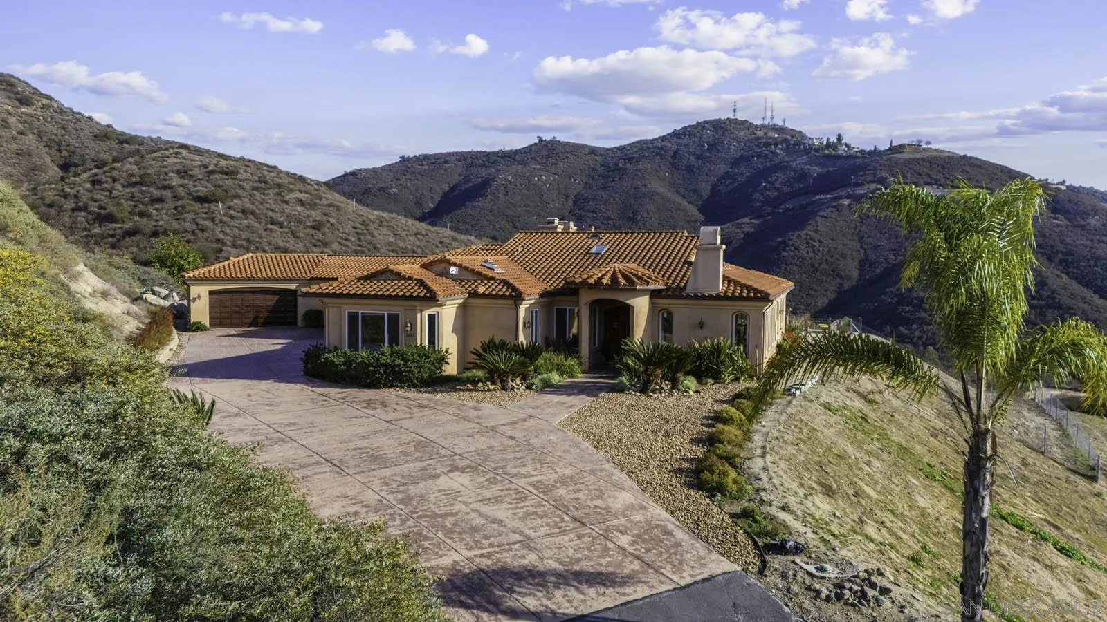 2247 Margarita Glen Fallbrook, CA 92028 - Photo 31 of 40 a front view of a house with a yard and mountain view in back