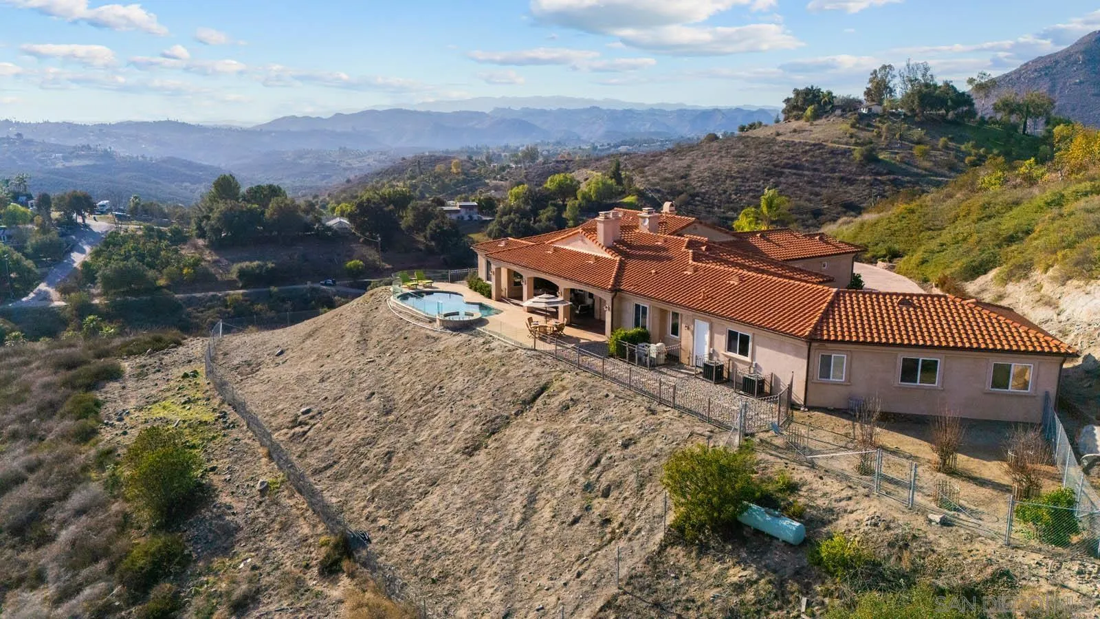 2247 Margarita Glen Fallbrook, CA 92028 - Photo 33 of 40 a view of a house with a mountain in the background