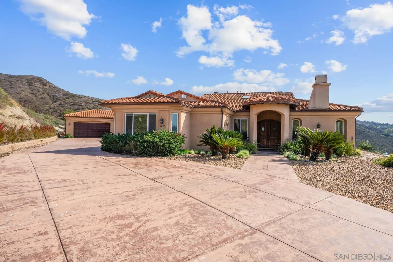 2247 Margarita Glen Fallbrook, CA 92028 - Photo 37 of 40 a view of a house with a yard and potted plants