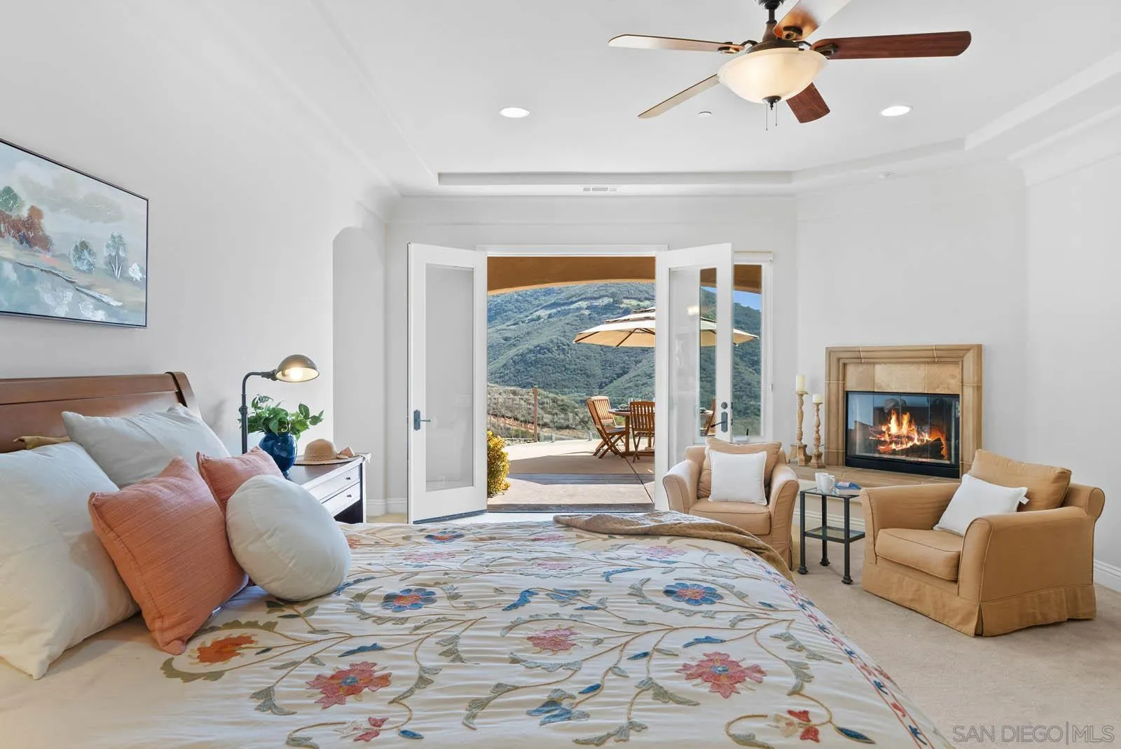 2247 Margarita Glen Fallbrook, CA 92028 - Photo 5 of 40 a bedroom with a bed large window couch and a view of bedroom