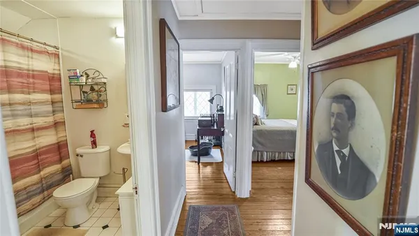 a bedroom with a bed and flat screen tv