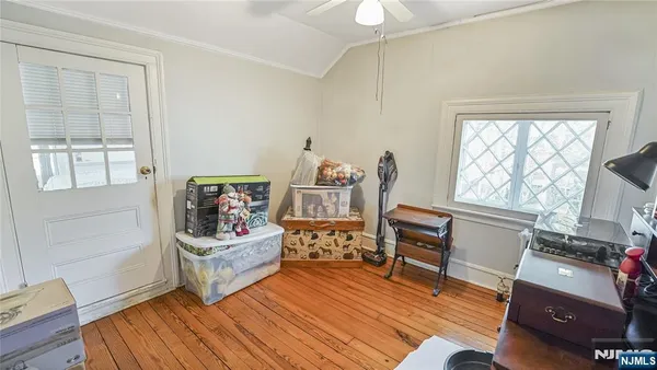 a view of a kitchen with fridge and workspace