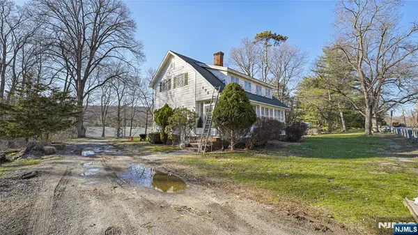 a view of a swimming pool with a yard