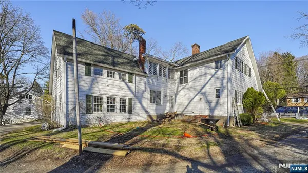 a view of a tall building next to a road