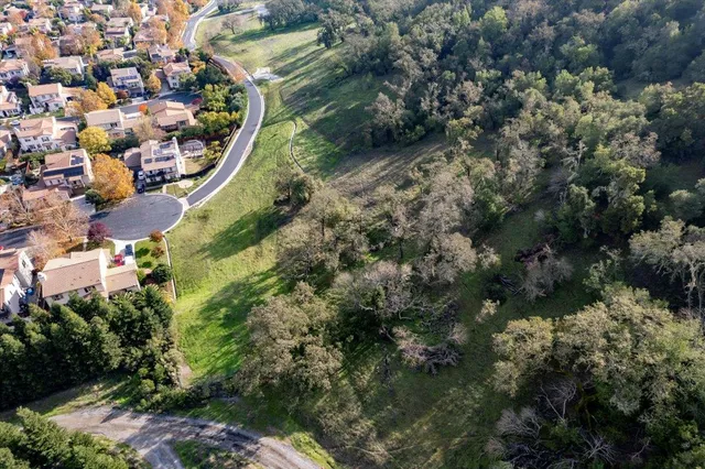 an aerial view of residential house and outdoor space