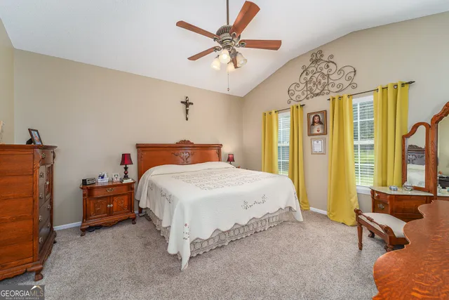 a bedroom with a bed and a table in it