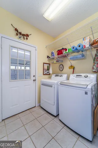 a utility room with dryer and washer
