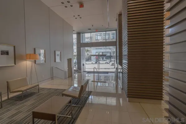 a view of a hallway with seating area