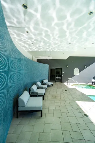 a view of a terrace with couches and sky view