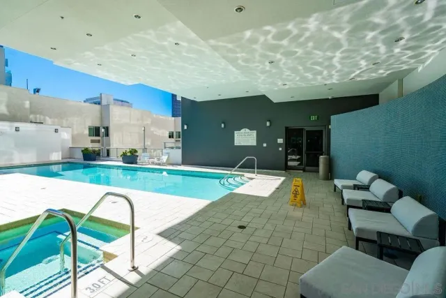 a view of swimming pool with seating space