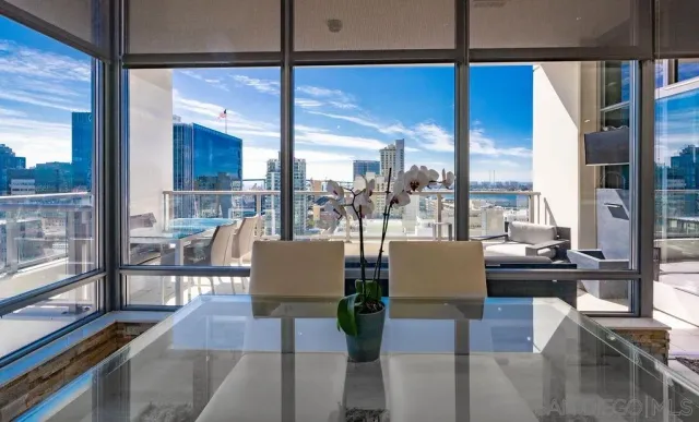 a living room with fireplace furniture and a floor to ceiling window