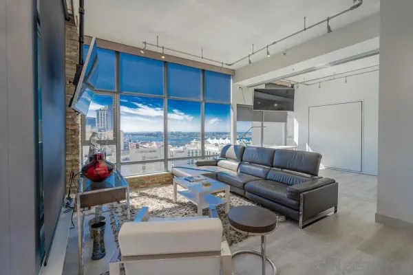 a living room with furniture and a large window