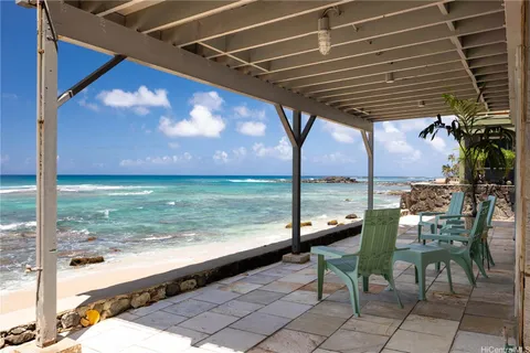 a view of a chairs and table in the patio