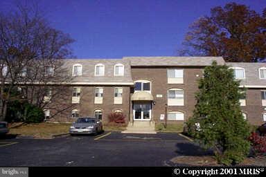 12007 Tarragon Road, Unit 12007 Reisterstown, MD 21136 - Photo 1 of 10 a front view of a house with a yard