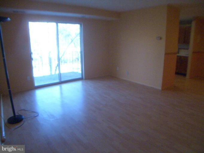 12007 Tarragon Road, Unit 12007 Reisterstown, MD 21136 - Photo 2 of 10 a view of an empty room with a window