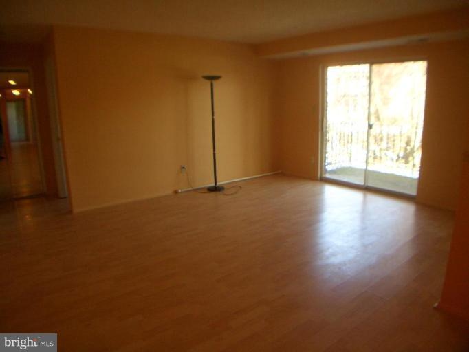 12007 Tarragon Road, Unit 12007 Reisterstown, MD 21136 - Photo 4 of 10 a view of an empty room and a window