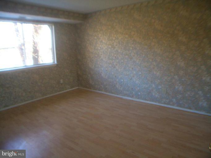 12007 Tarragon Road, Unit 12007 Reisterstown, MD 21136 - Photo 7 of 10 an empty room with a window