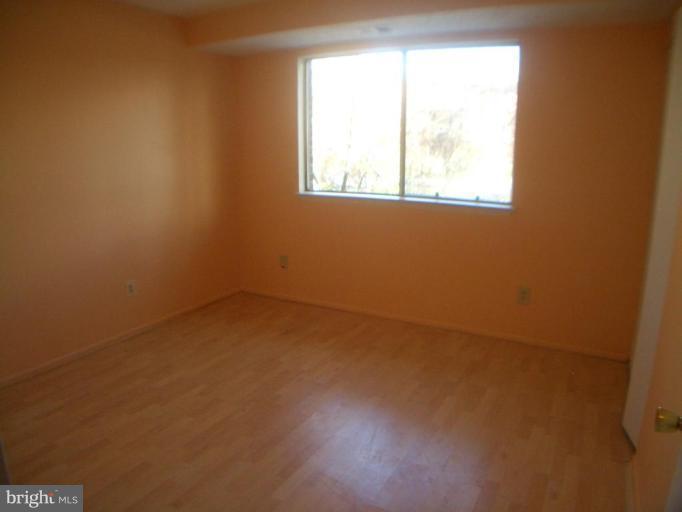 12007 Tarragon Road, Unit 12007 Reisterstown, MD 21136 - Photo 8 of 10 an empty room with a window
