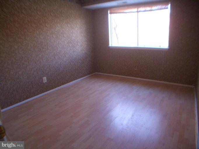 12007 Tarragon Road, Unit 12007 Reisterstown, MD 21136 - Photo 9 of 10 an empty room with a window